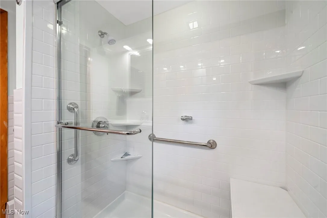 Bathroom featuring a shower stall