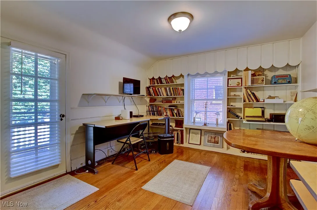 Office area with light wood-style floors