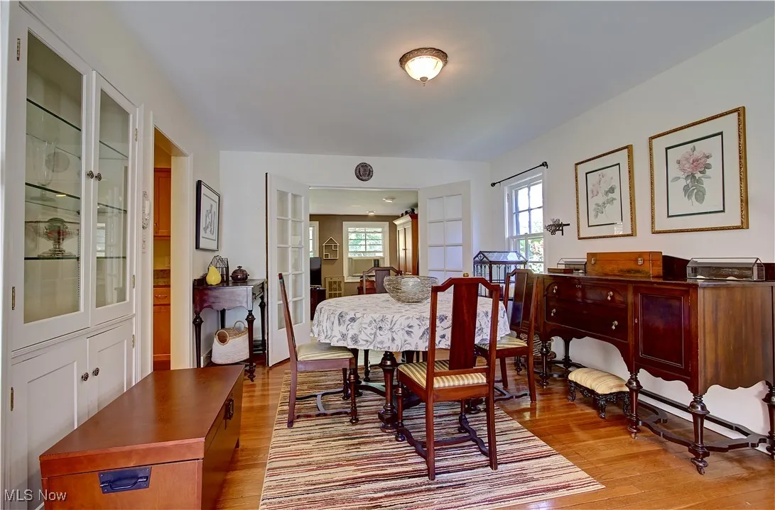 Dining space featuring light wood-style flooring and french doors