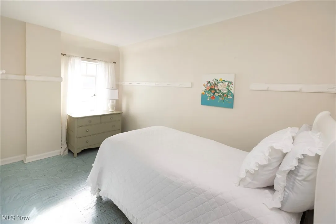 Bedroom #4 offers painted hardwood floors and a sunny space to enjoy some privacy!
