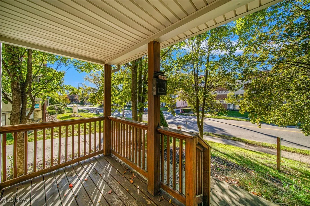 Wooden porch featuring a residential view