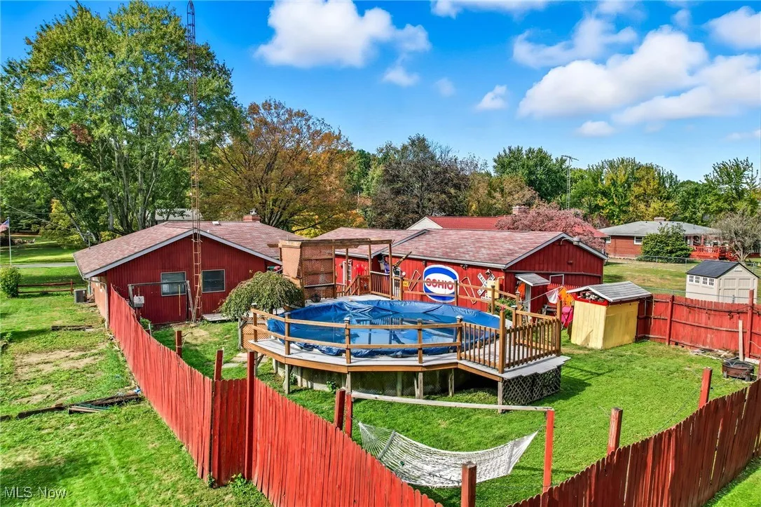 private back yard with above ground pool