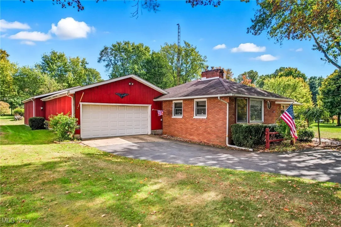 black top drive. Four car tandem garage offers plenty of space for a work shop