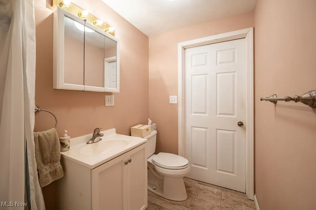 Bathroom with vanity and toilet