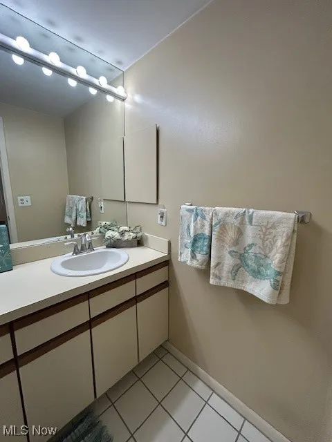 Bathroom featuring vanity and light tile patterned floors