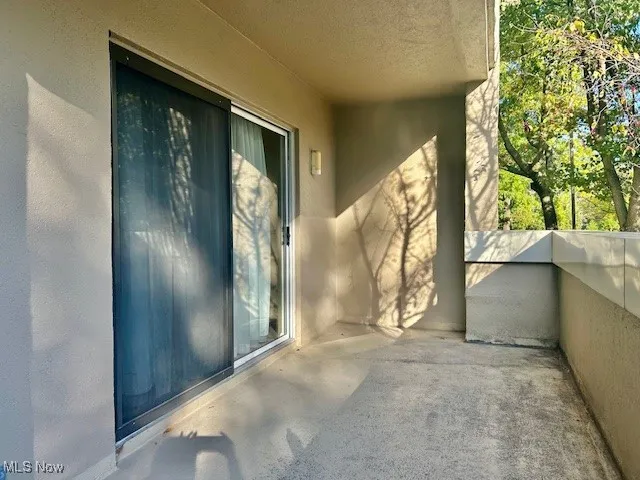 Doorway to property with stucco siding