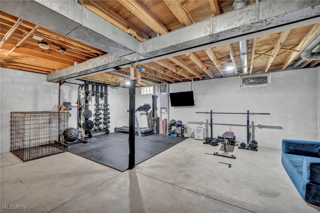 Exercise room featuring concrete flooring