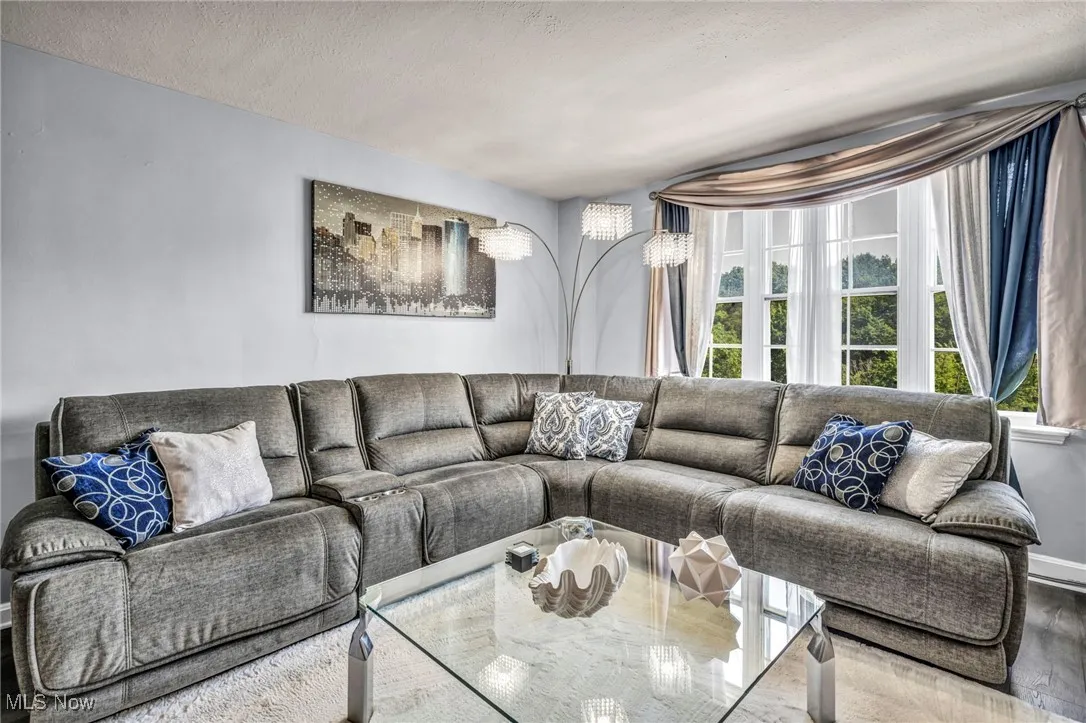 Living room featuring wood finished floors and a textured ceiling