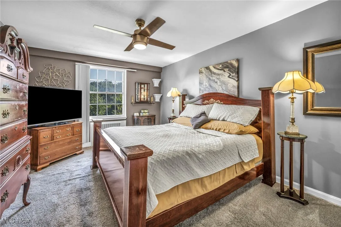 Bedroom featuring carpet flooring and a ceiling fan