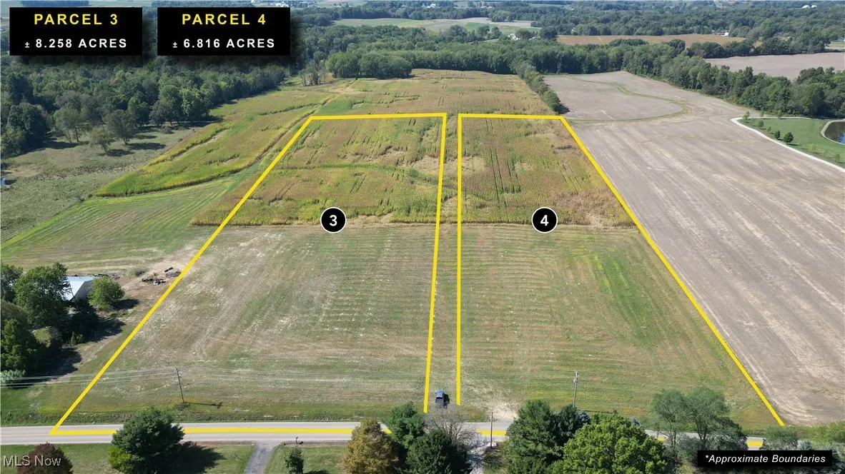 Overview of rural landscape featuring property parcel outlined and rows of crops