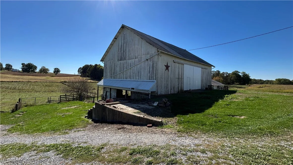 View of barn featuring a view of rural / pastoral area