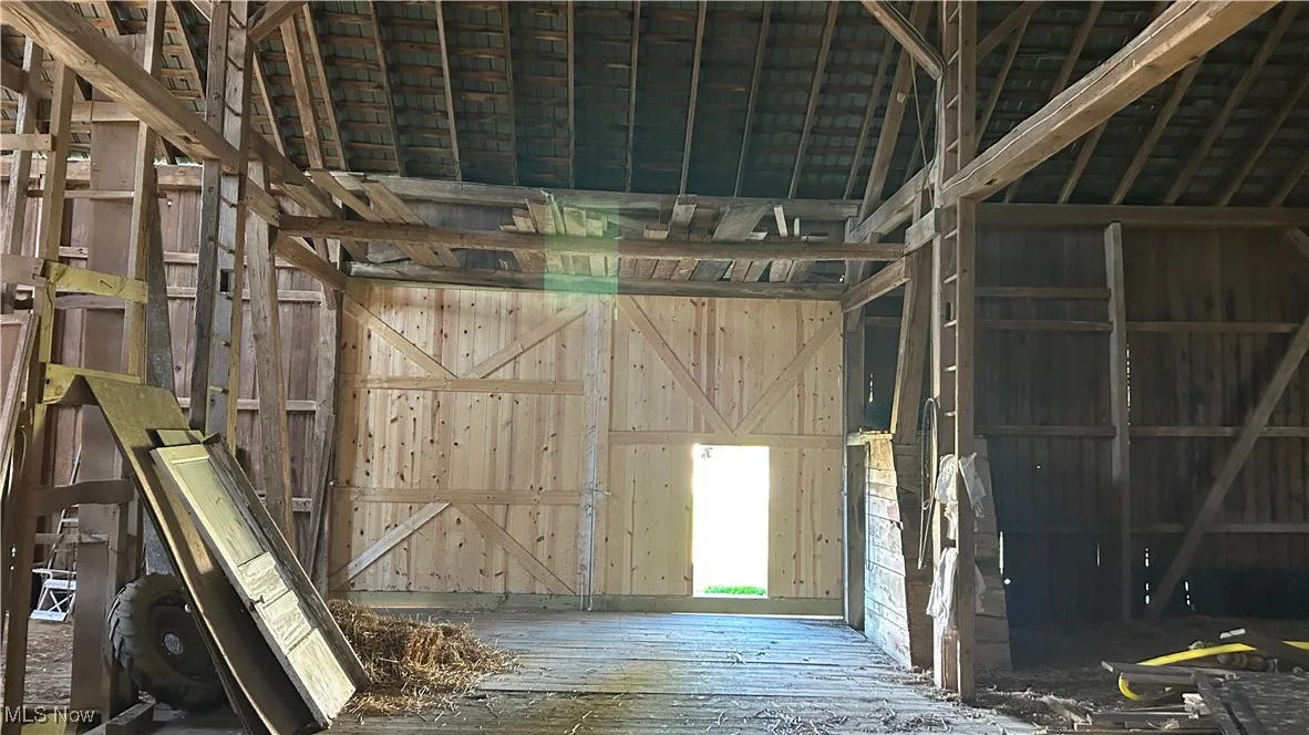 Miscellaneous room with wood-type flooring