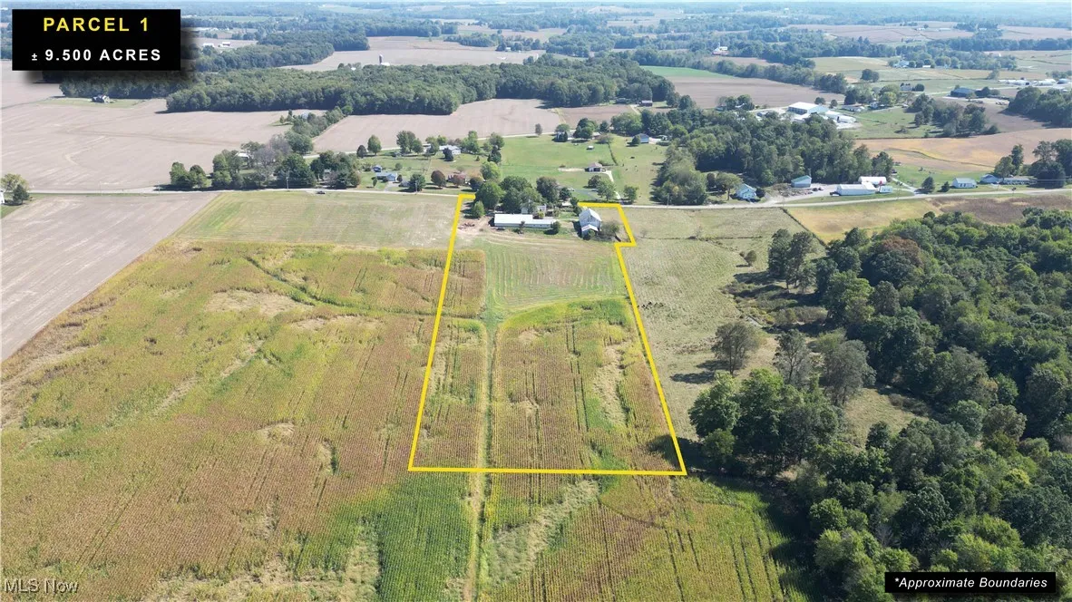 Aerial view of sparsely populated area featuring property boundaries highlighted