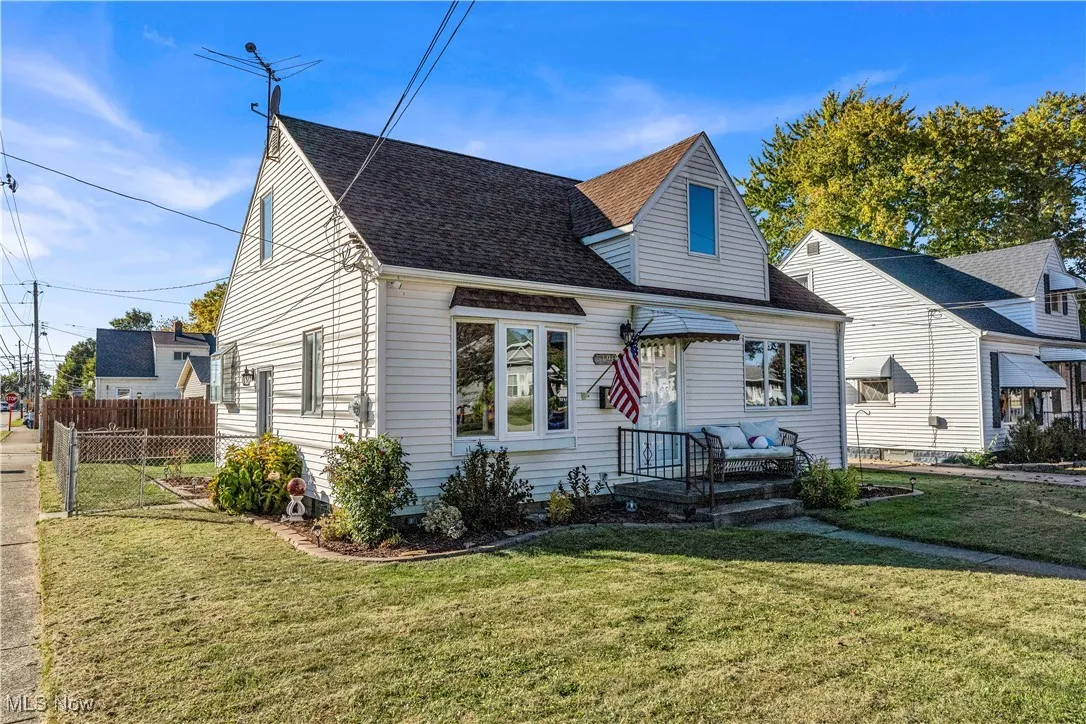 View of front of home featuring a shingled roof