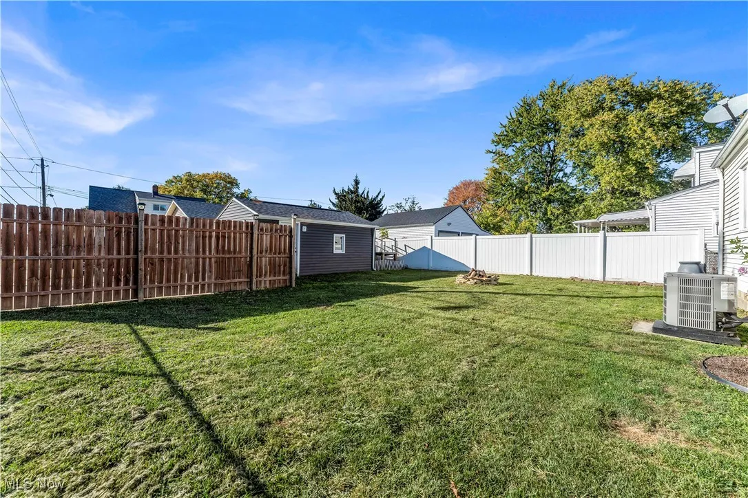 View of fenced backyard