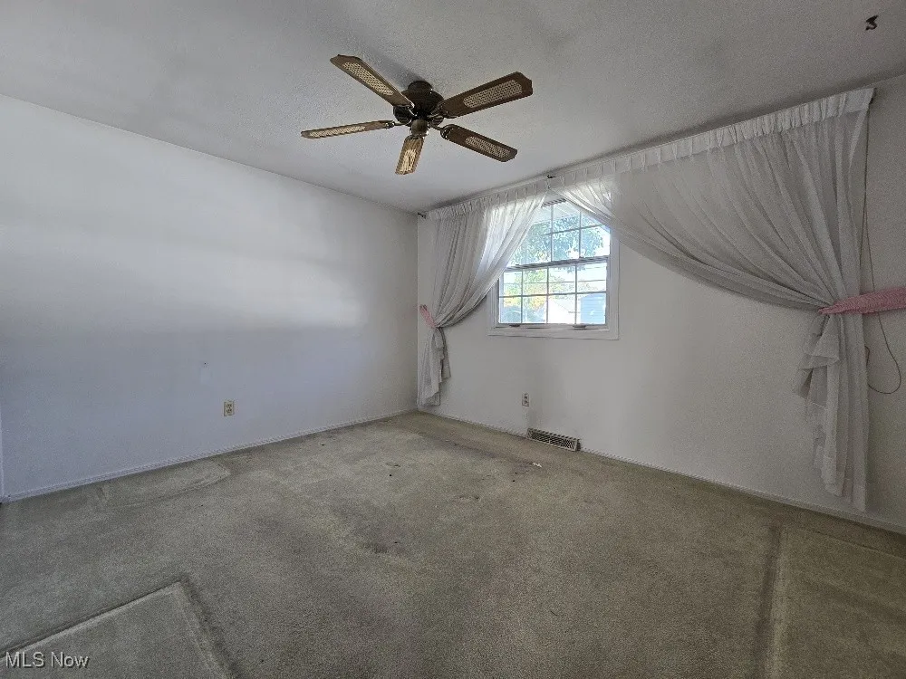 Bedroom with Carpeting covering Hardwood Floors!