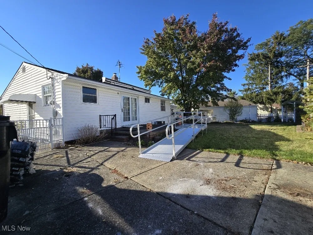Back of property featuring a Patio and Fenced perimeter!  Ramp has been contracted for removal.