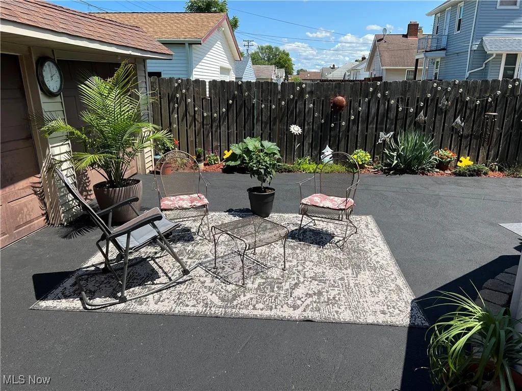 Fenced backyard featuring a patio area