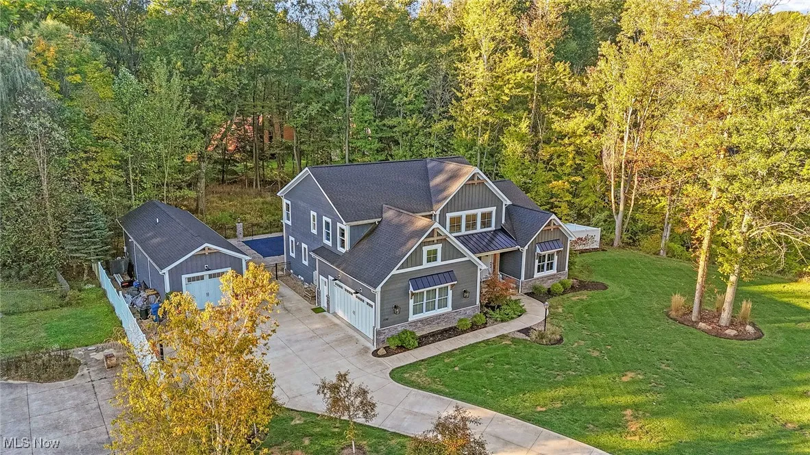 Aerial view with an additional detached garage