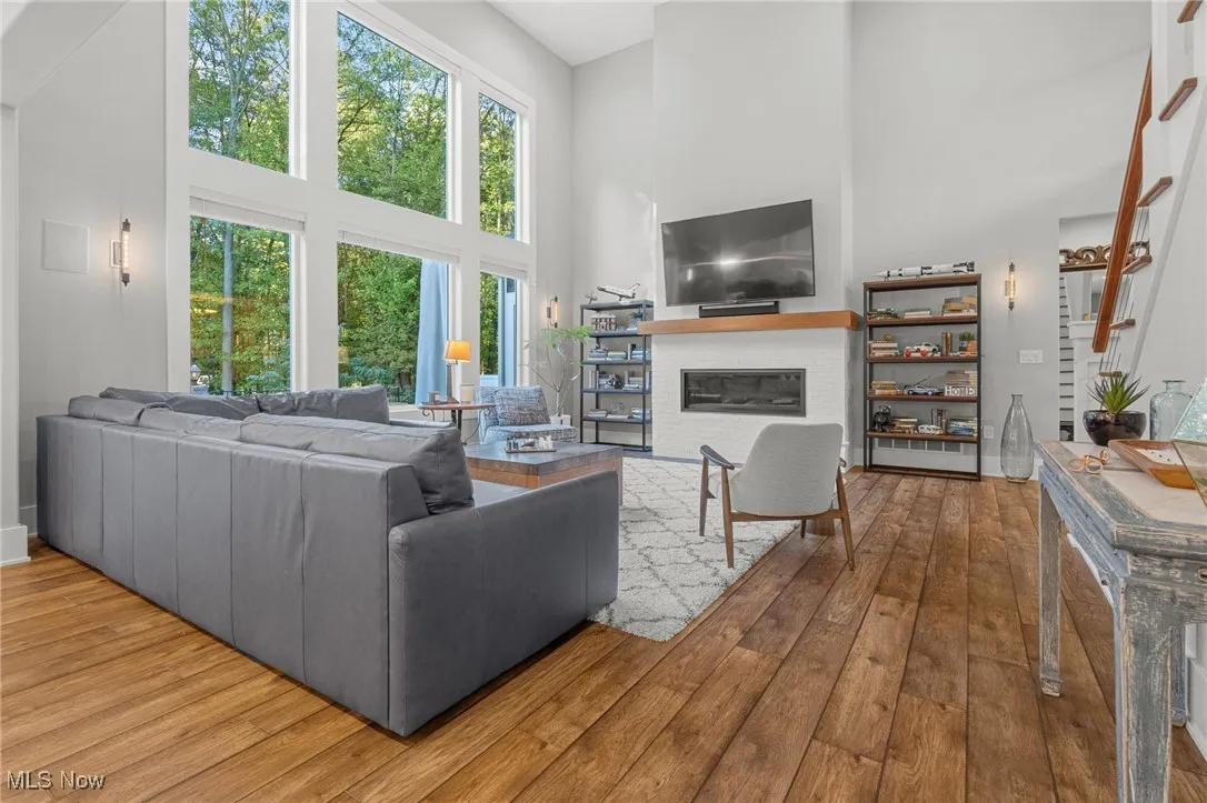 Spacious great room with LVT flooring, fireplace, and plenty of natural light