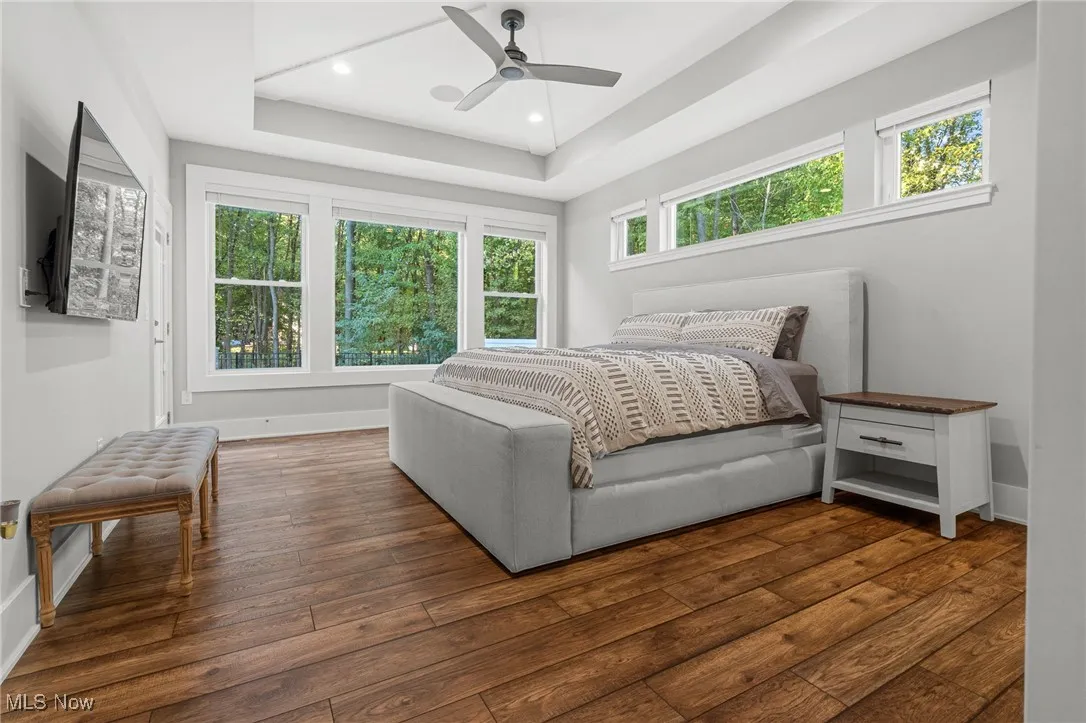 Lovely first floor owners suite with plenty of natural light, LVT flooring and more