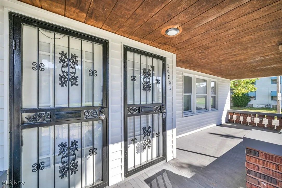 Property entrance with covered porch