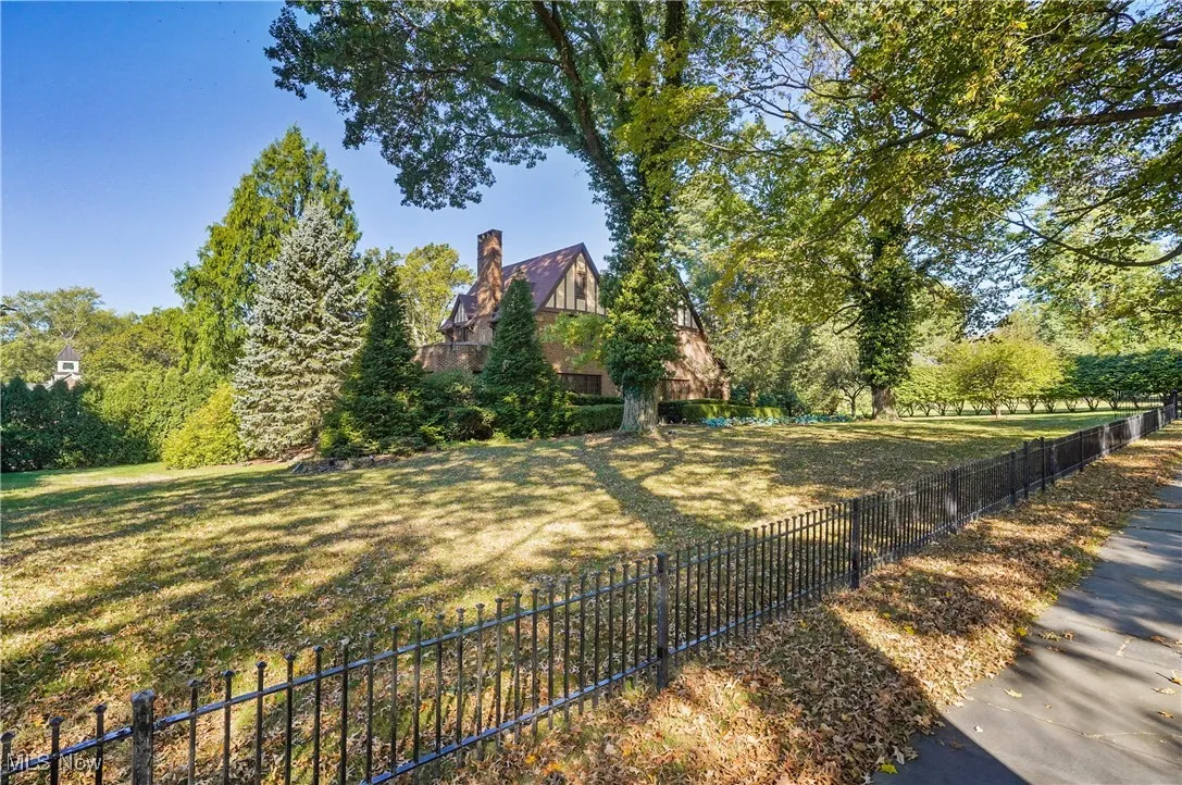 featuring wrought iron fence along front of house