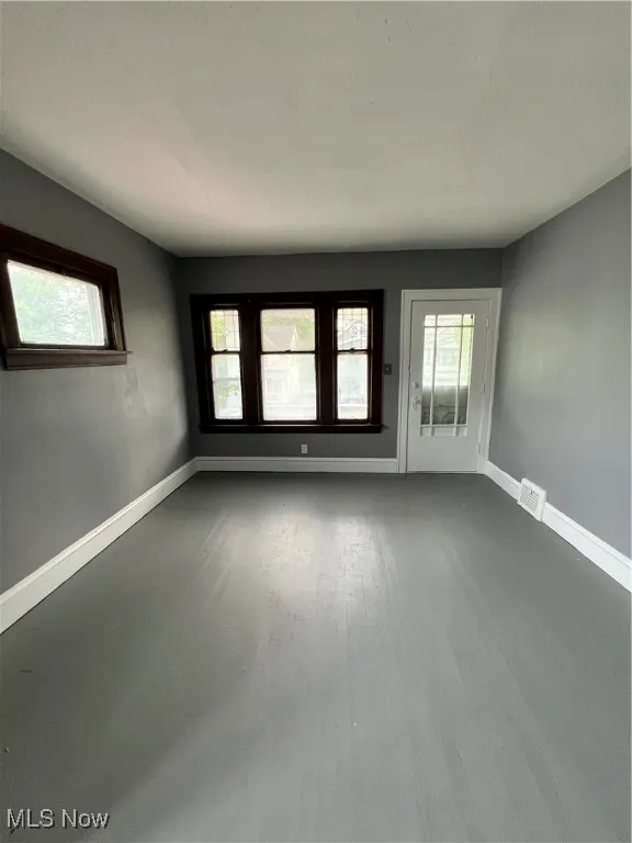 Living room with baseboards and wood finished floors