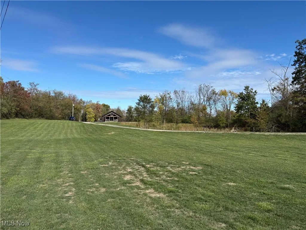 View of property's community featuring a lawn