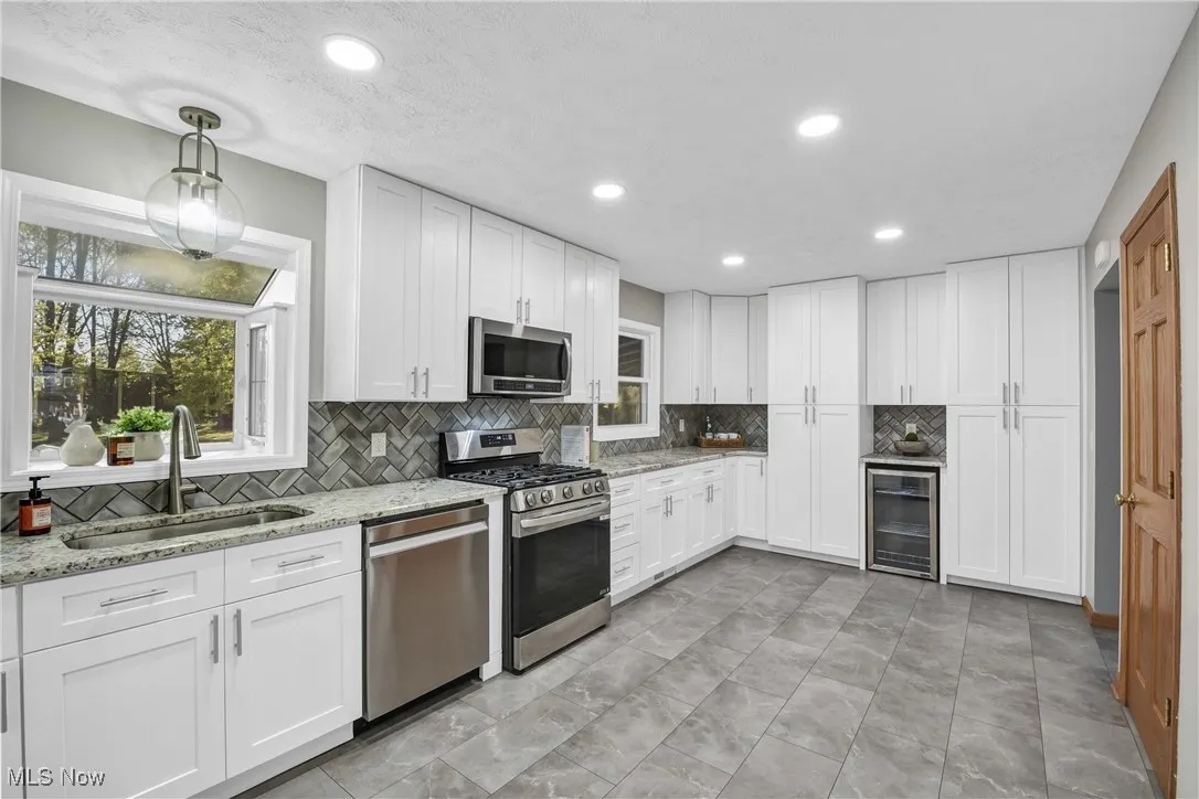 Large recently renovated kitchen. 2 pantries with drink fridge.