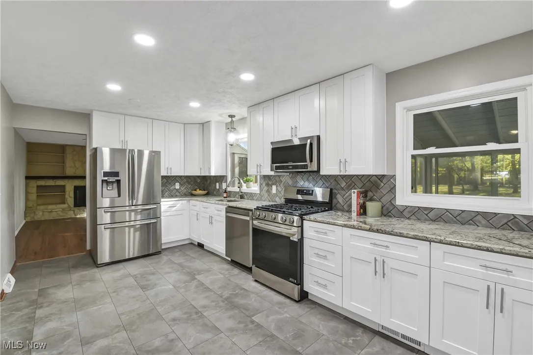 Granite countertops and abundance of cabinets.