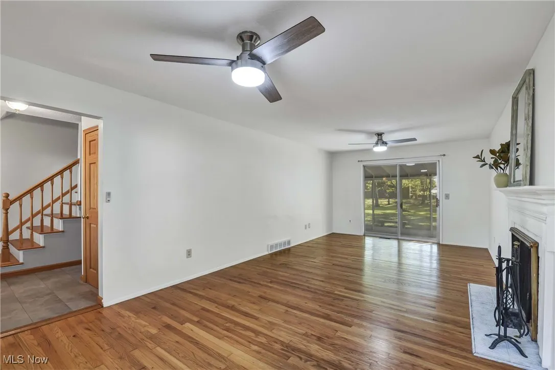Living room with sliding glass doors to screened porch.