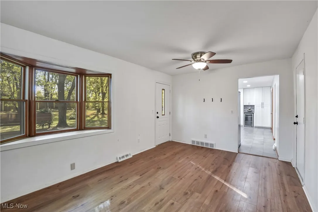 Cozy family room with new LVT flooring and wood burning fireplace.