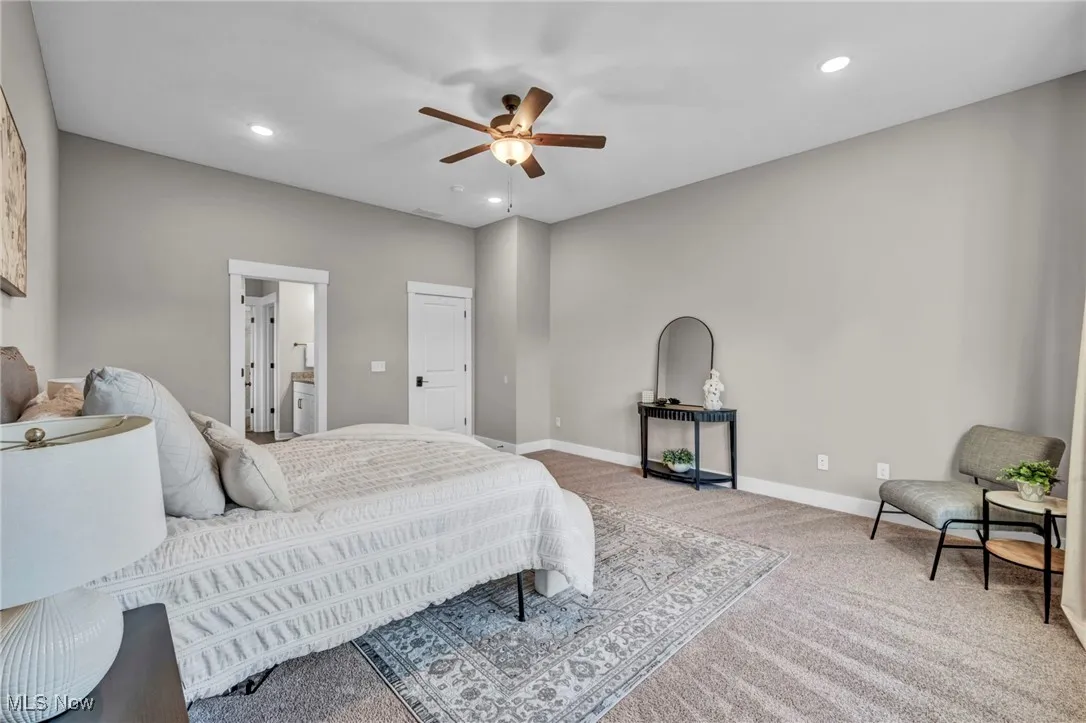 Bedroom featuring carpet floors, recessed lighting, a ceiling fan, and ensuite bathroom