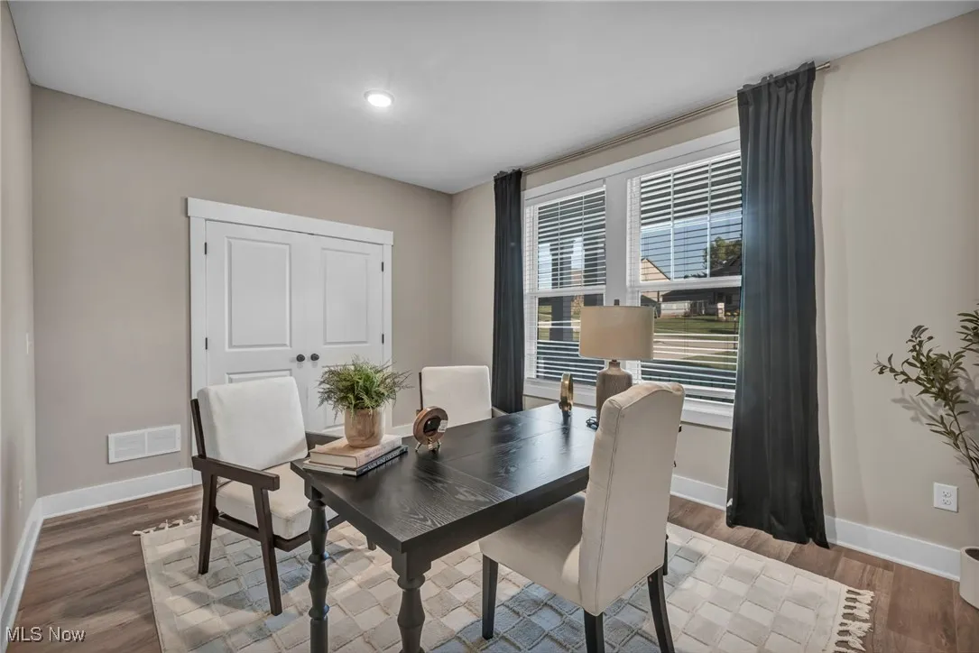Dining room with baseboards and wood finished floors