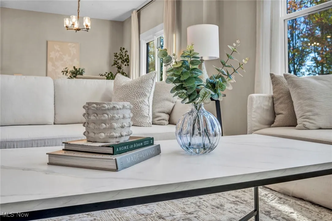 Living room featuring a chandelier