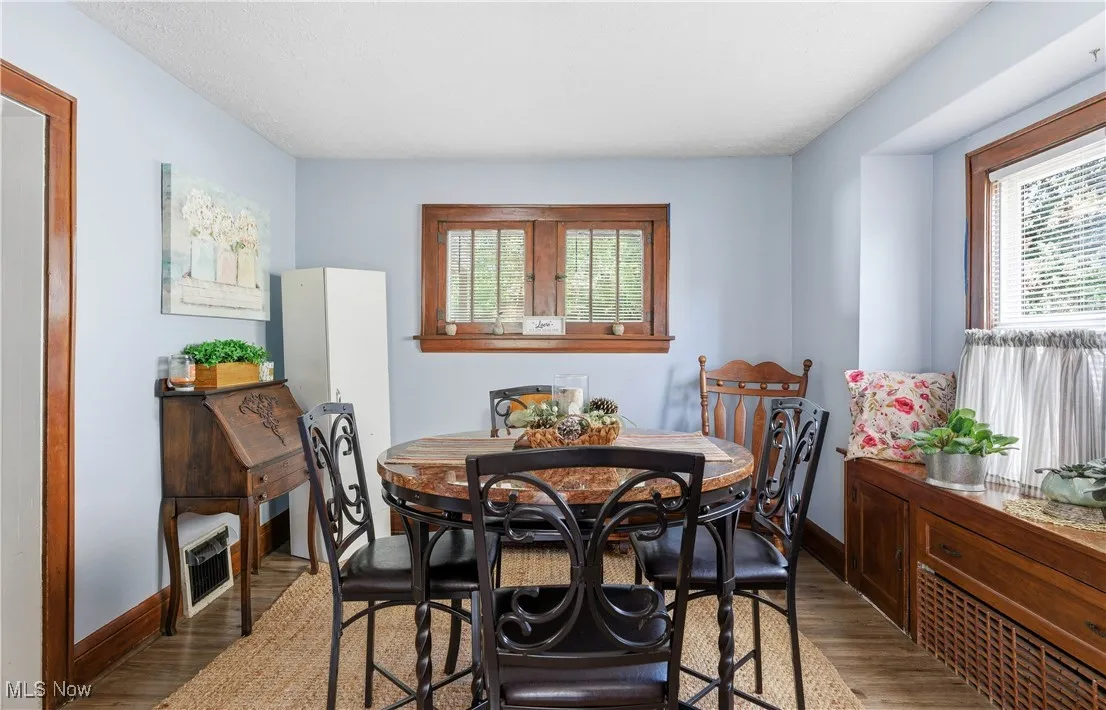 Dining room featuring baseboards and wood finished floors