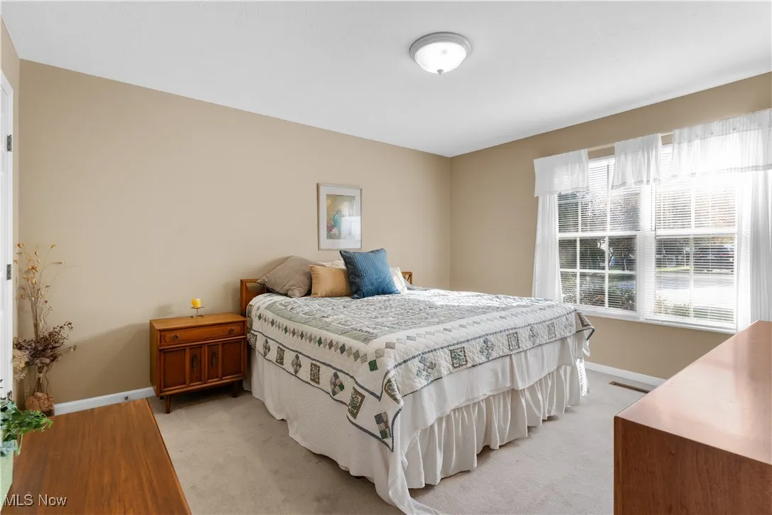 1st floor Bedroom with baseboards/wood finished floors