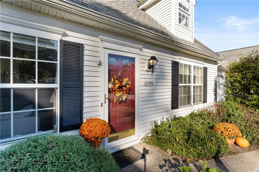 Property entrance with roof with shingles