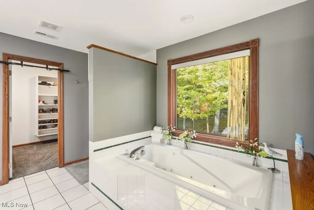 Master Bathroom with Jetted Tub, Separate Walk-in Shower, and Double Sinks