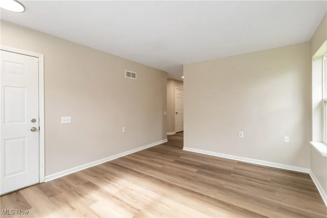 Empty room featuring light wood-style flooring and baseboards