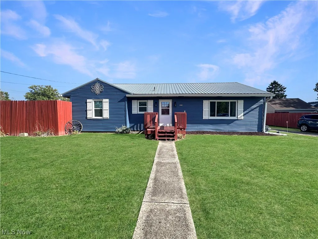 Ranch-style home with a metal roof
