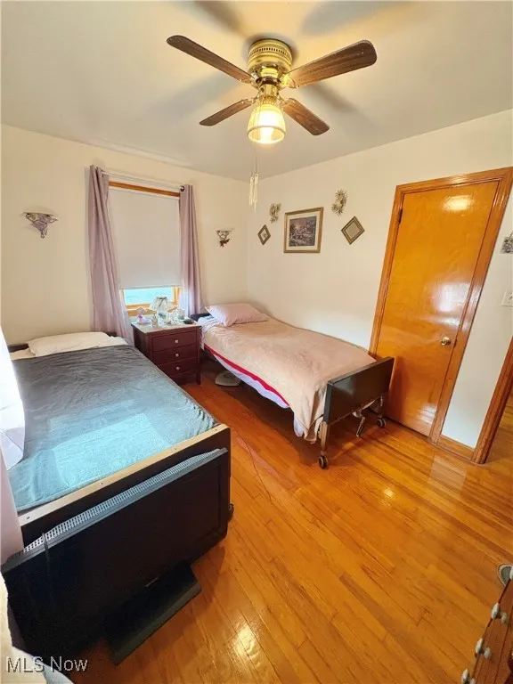 Bedroom featuring light wood-style flooring and a ceiling fan