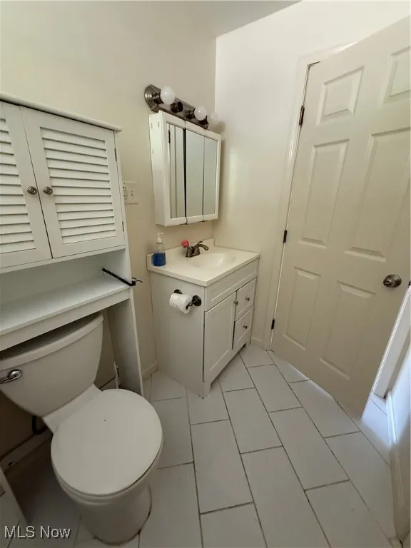 Bathroom with vanity and light tile patterned floors