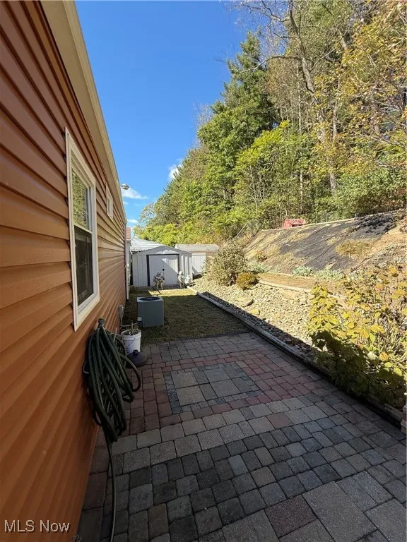 View of patio / terrace featuring an outbuilding