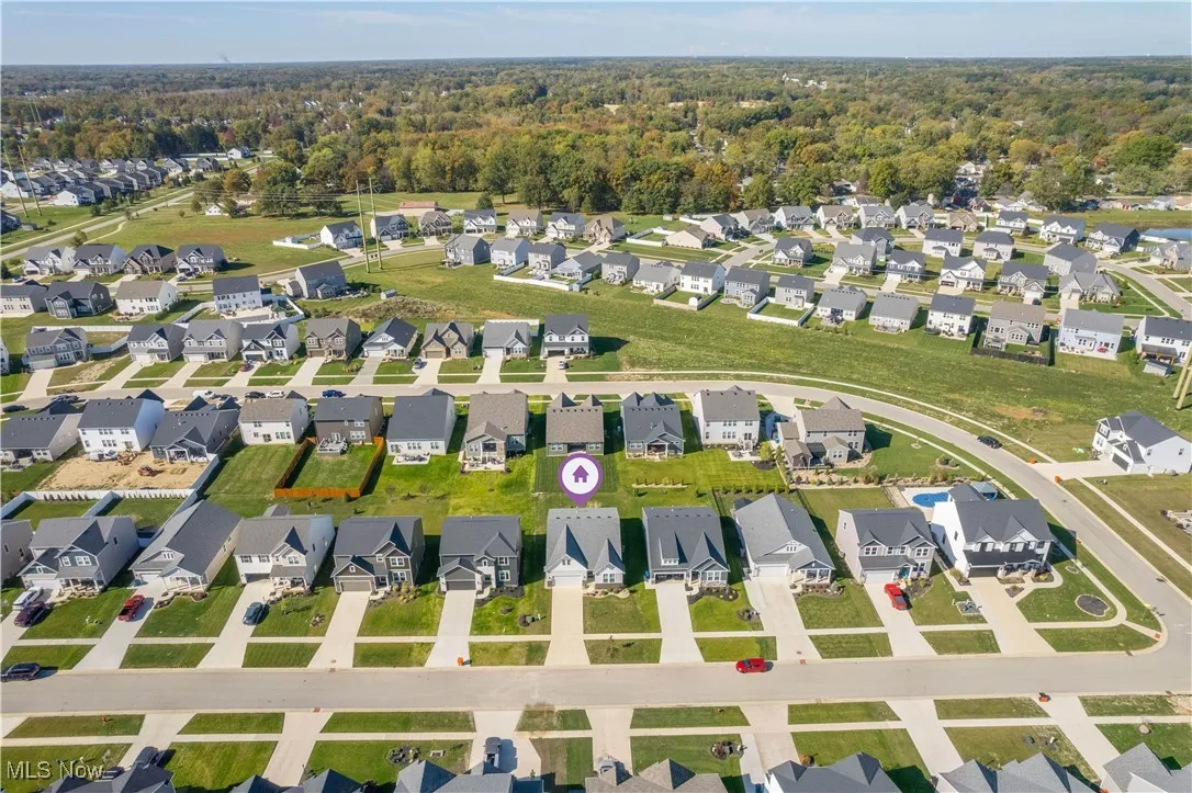Aerial overview of property's location featuring nearby suburban area