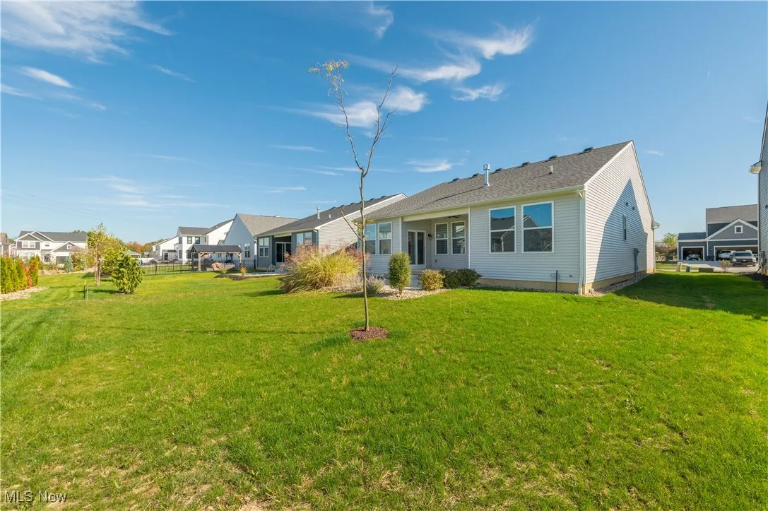 Rear view of property featuring a yard