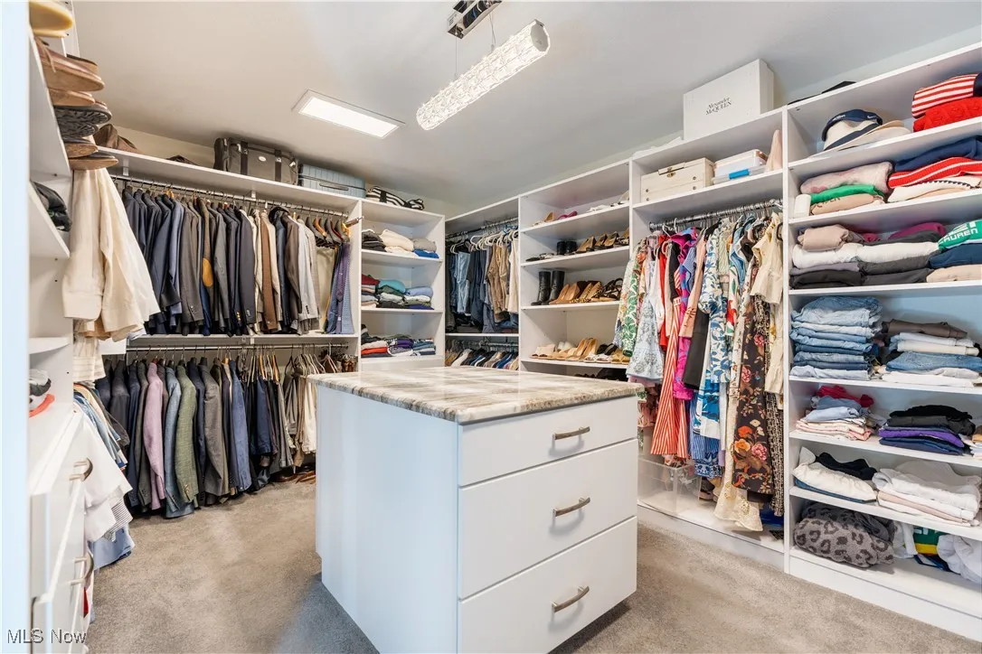 Amazing custom closet / dressing room space in the master suite.