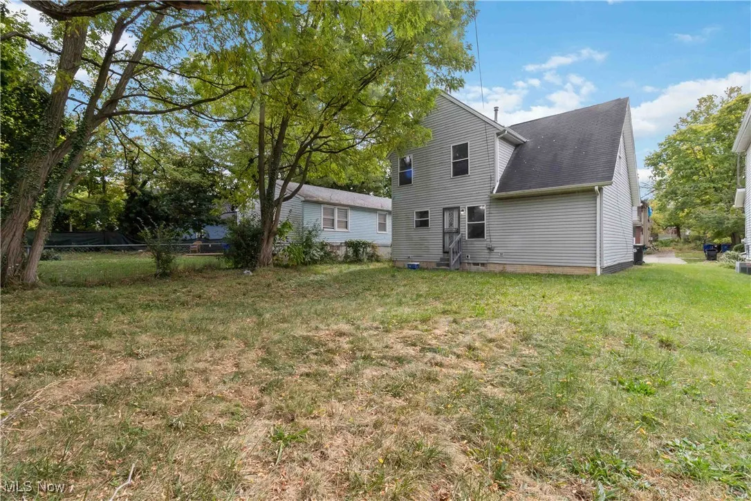 Rear view of house featuring crawl space