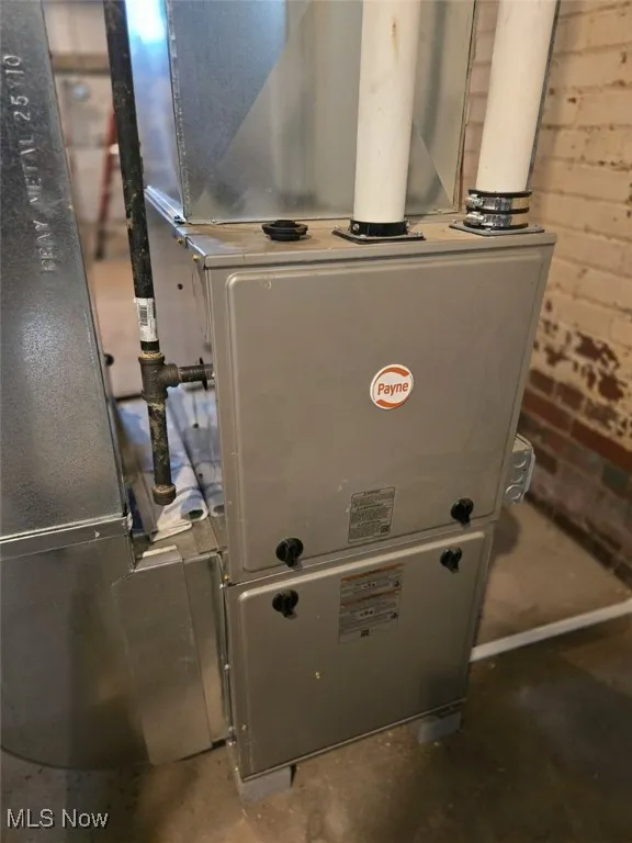 Utility room featuring heating unit
